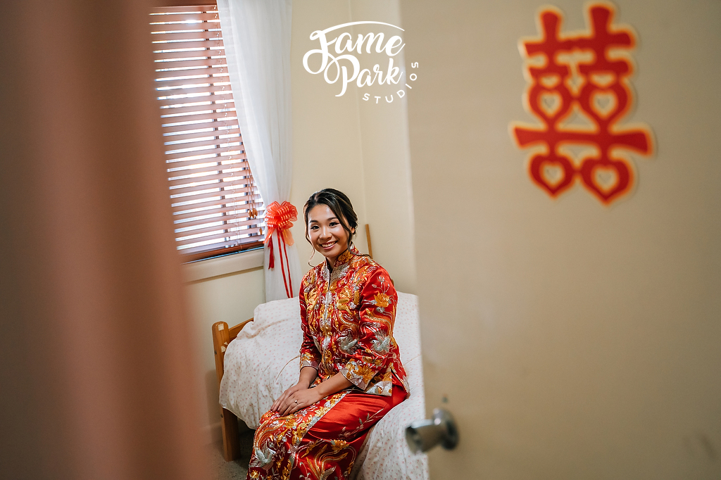 The Chinese bride is waiting for her fiancé coming from her parents’ house.