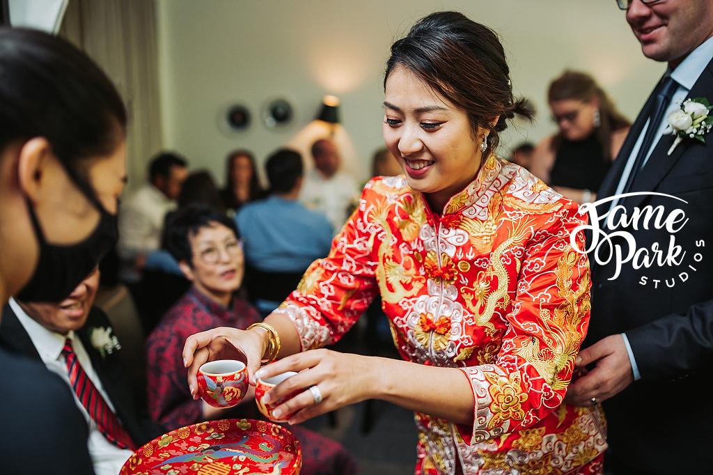 The Chinese bride is preparing the tea for her parents.